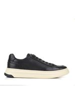 Zapatilla-de-cuero-clasica-negra-con-base-beige-cocida.jpg