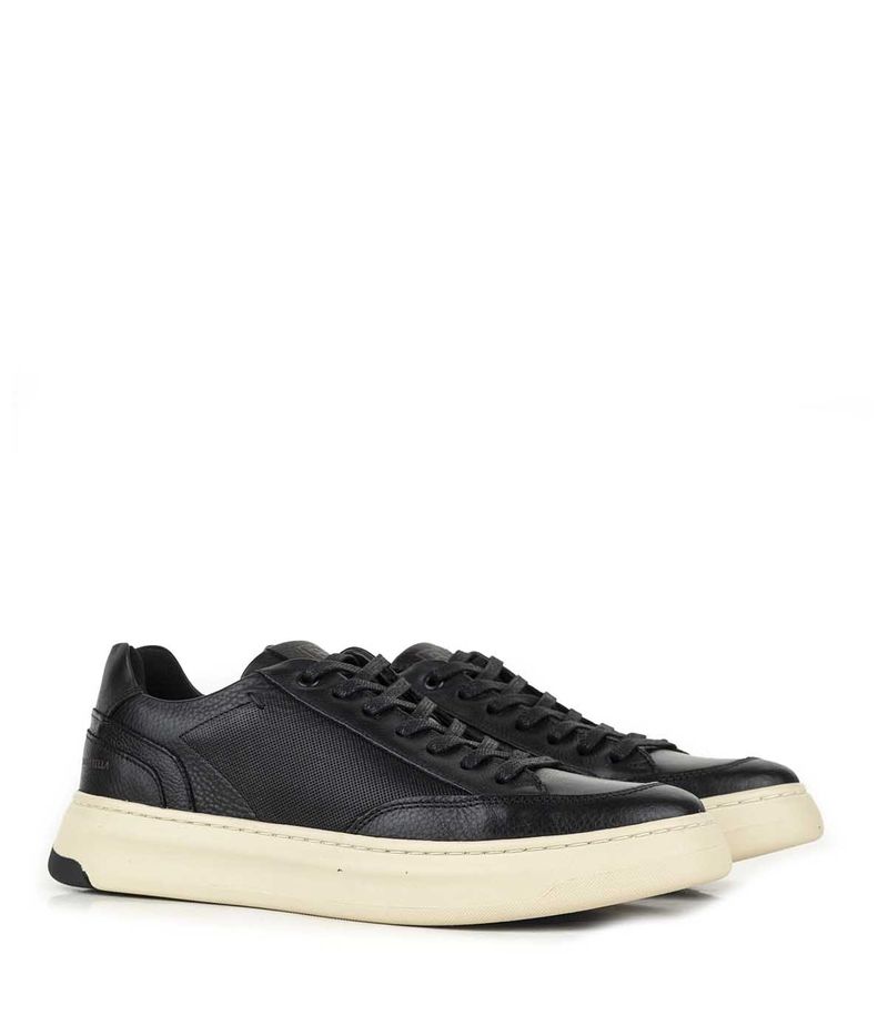 Zapatilla-de-cuero-clasica-negra-con-base-beige-cocida.jpg