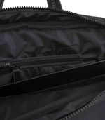 Mochila-minimalista-de-tela-engomada-con-detalles-simil-cuero.jpg